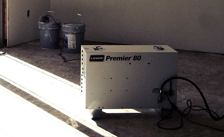 An L.B. White Premier 80 heating a residential home construction location.